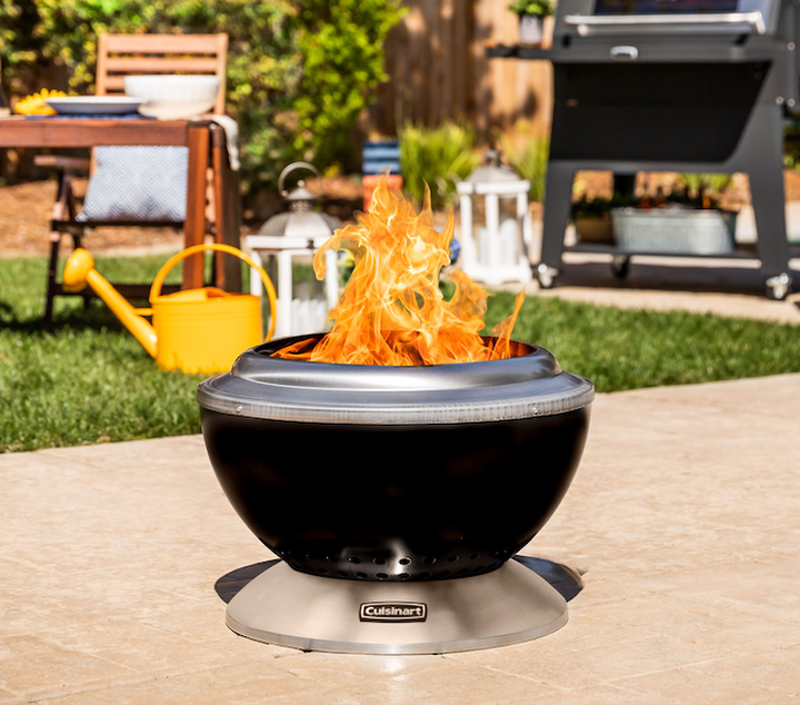 Smokeless fire pit outside on patio with big flames